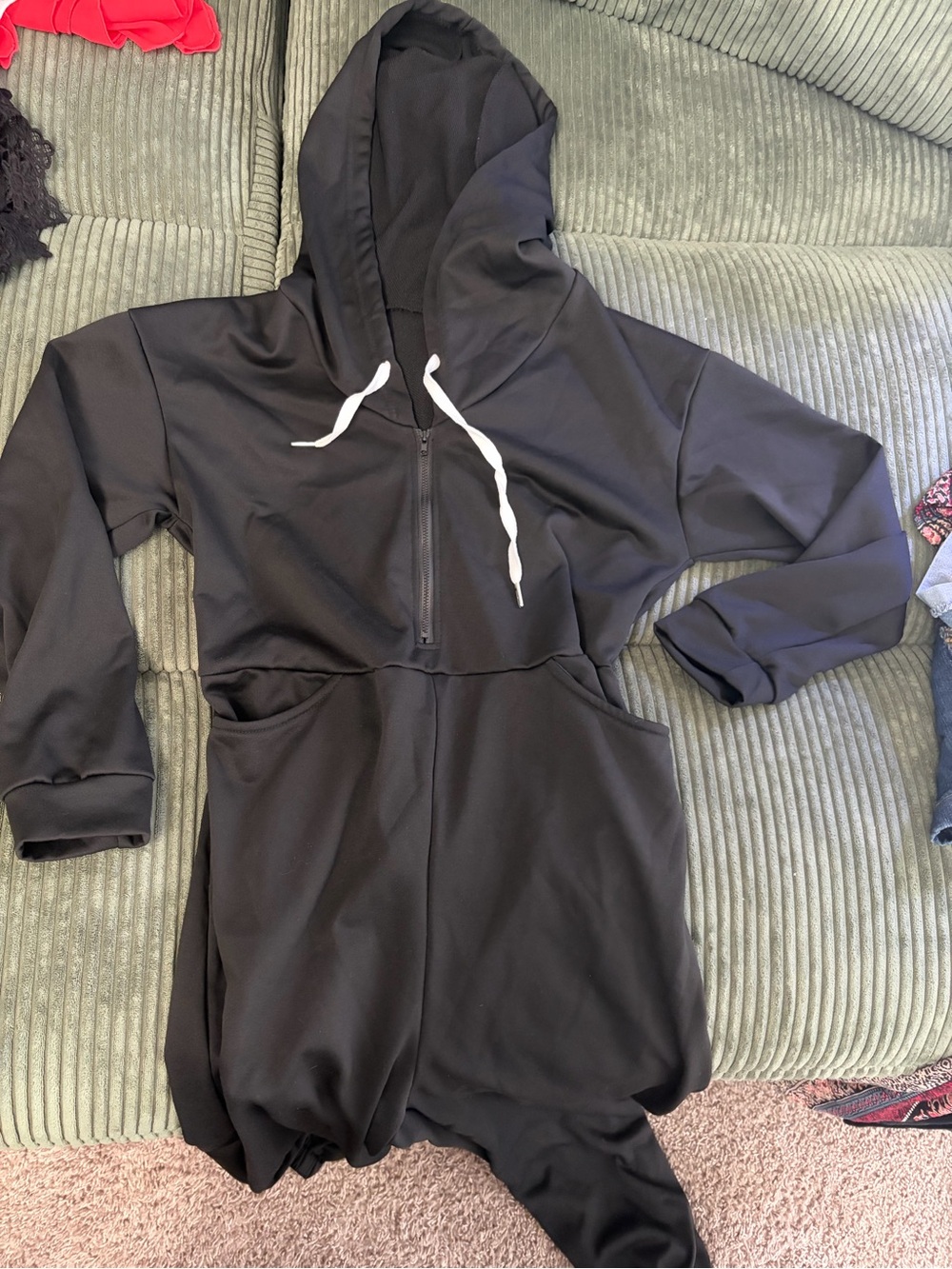 Black jumpsuit with hoodie, pockets and pull strings